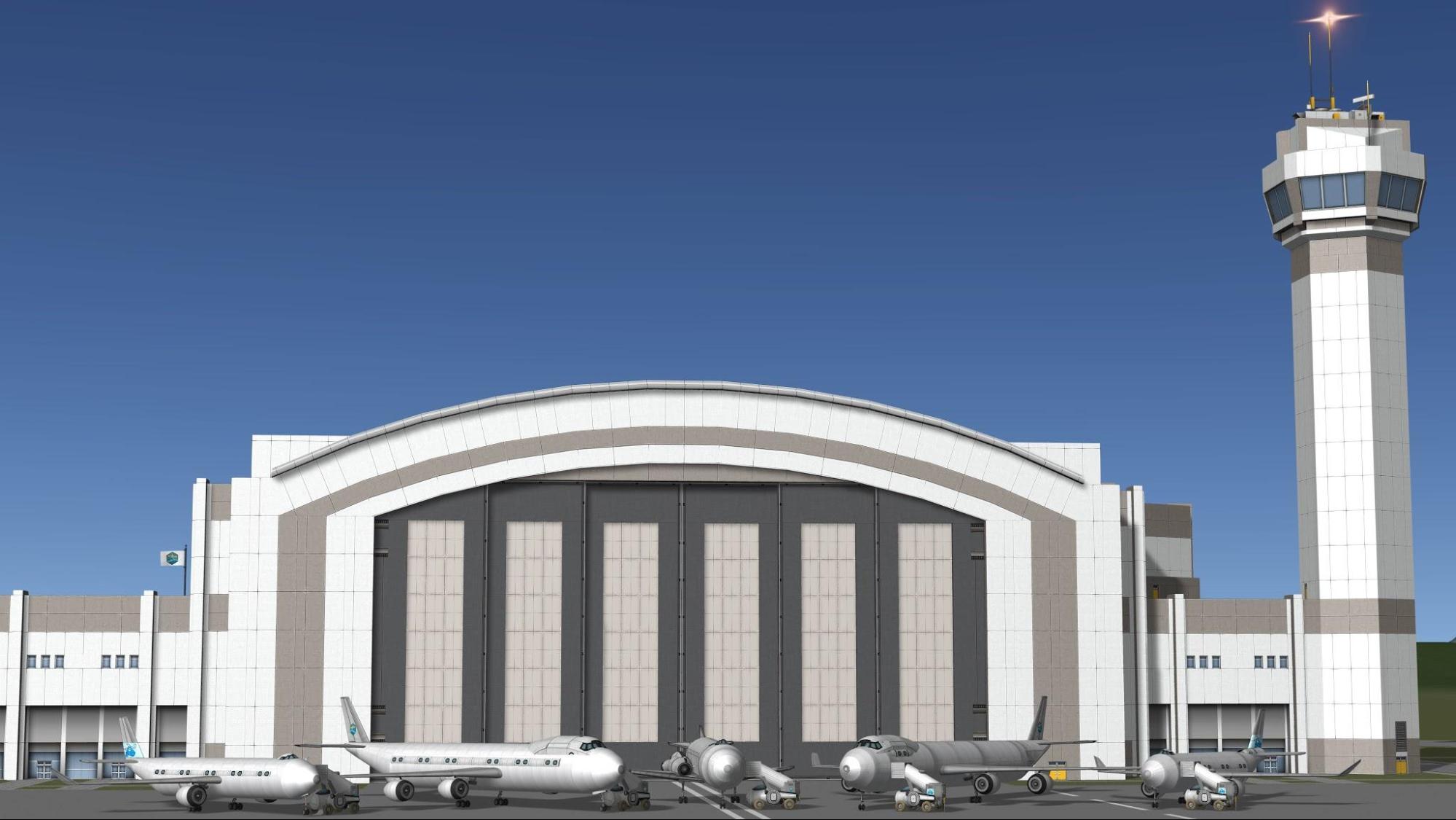 an assembly of multiple air and spacecraft in front of the hangar, seen from front